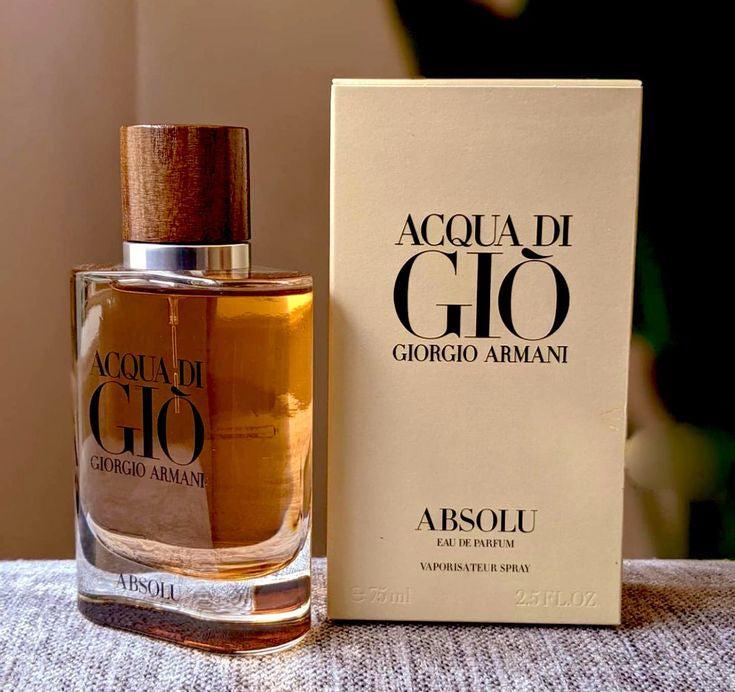 Acqua di GiΓ² Giorgio Armani perfume bottle and packaging on a textured surface.