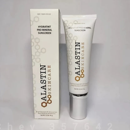 ALASTIN SKINCARE Hydratint Pro Mineral Sunscreen shown as a white squeeze tube with a silver cap next to its matching white packaging box on a light gray background.