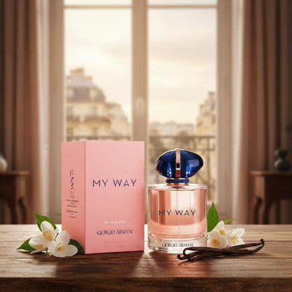 Giorgio Armani 'My Way' perfume bottle and packaging on a wooden table with flowers.