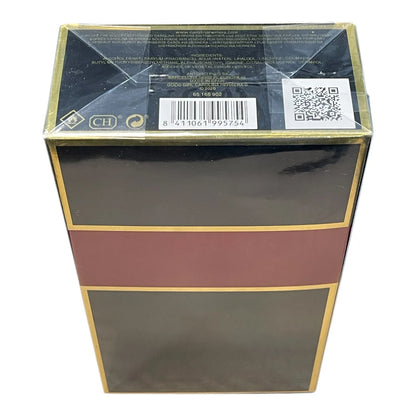 A rectangular product box with a glossy black finish, featuring a wide horizontal burgundy band across the middle and thin gold borders. The top flap is sealed with clear plastic wrap and shows a barcode, QR code, and small certification logos.