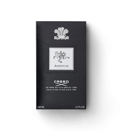 Creed Aventus 100ml box packaging, featuring a textured black background with a silver crest and logo details, set against a plain white background.