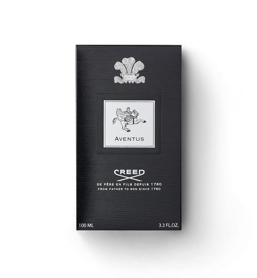 Creed Aventus 100ml box packaging, featuring a textured black background with a silver crest and logo details, set against a plain white background.