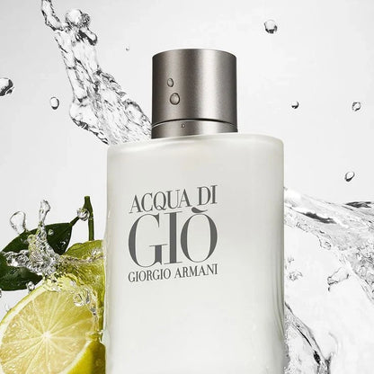 Giorgio Armani Acqua di Gio perfume bottle with water splash and lime slice on a light gray background