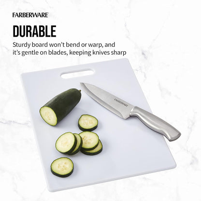 Farberware cutting board with sliced zucchini and knife on a white background
