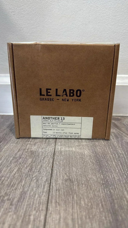 Brown box with 'Le Labo' branding on a wooden surface.