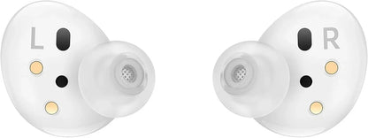 A pair of white wireless earbuds with transparent silicone tips, featuring gold and black sensor accents and L/R markings on a plain white background.