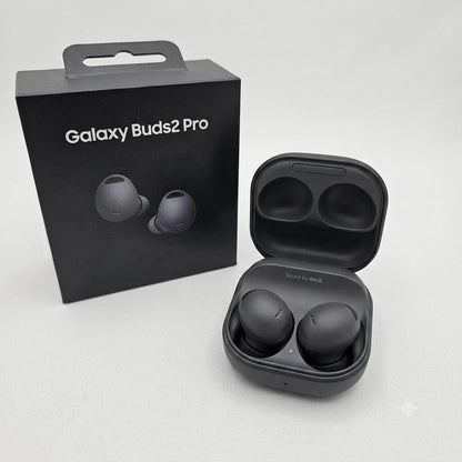 Black Samsung Galaxy Buds2 Pro wireless earbuds shown next to their original retail packaging box, with the charging case open to display the earbuds inside.