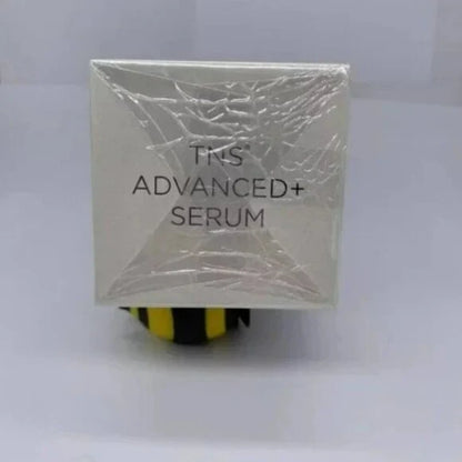 A square white skincare serum box wrapped in clear plastic, with the text 'TNS ADVANCED+ SERUM' visible on the front, set against a plain light background.