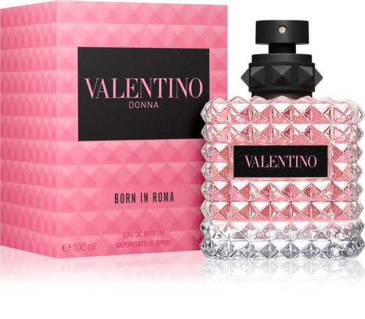 Valentino Donna Born in Roma Eau de Parfum bottle with a textured pink and clear diamond-patterned glass body, black cap, and a pink box with a black Valentino logo label.