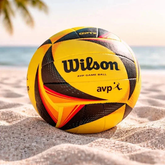 Wilson AVP game ball on a sandy beach with ocean view