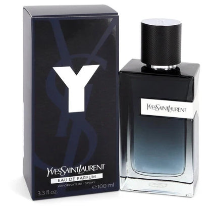 Yves Saint Laurent Eau de Parfum 100ml bottle next to its black packaging box, featuring a prominent white 'Y' logo on a clean white background.